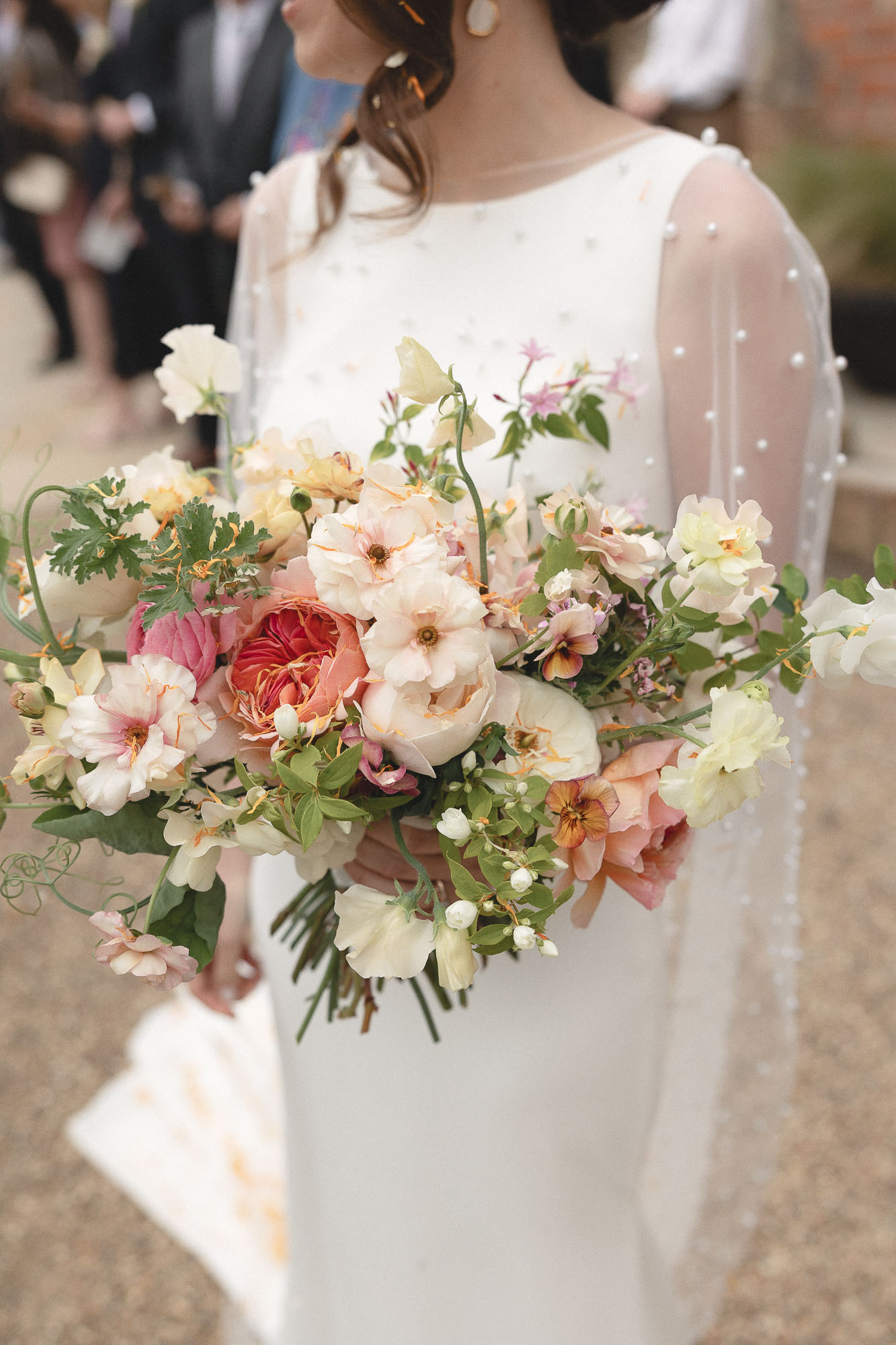 Bride holding bouquet. Photog ©Daisy Price Photography